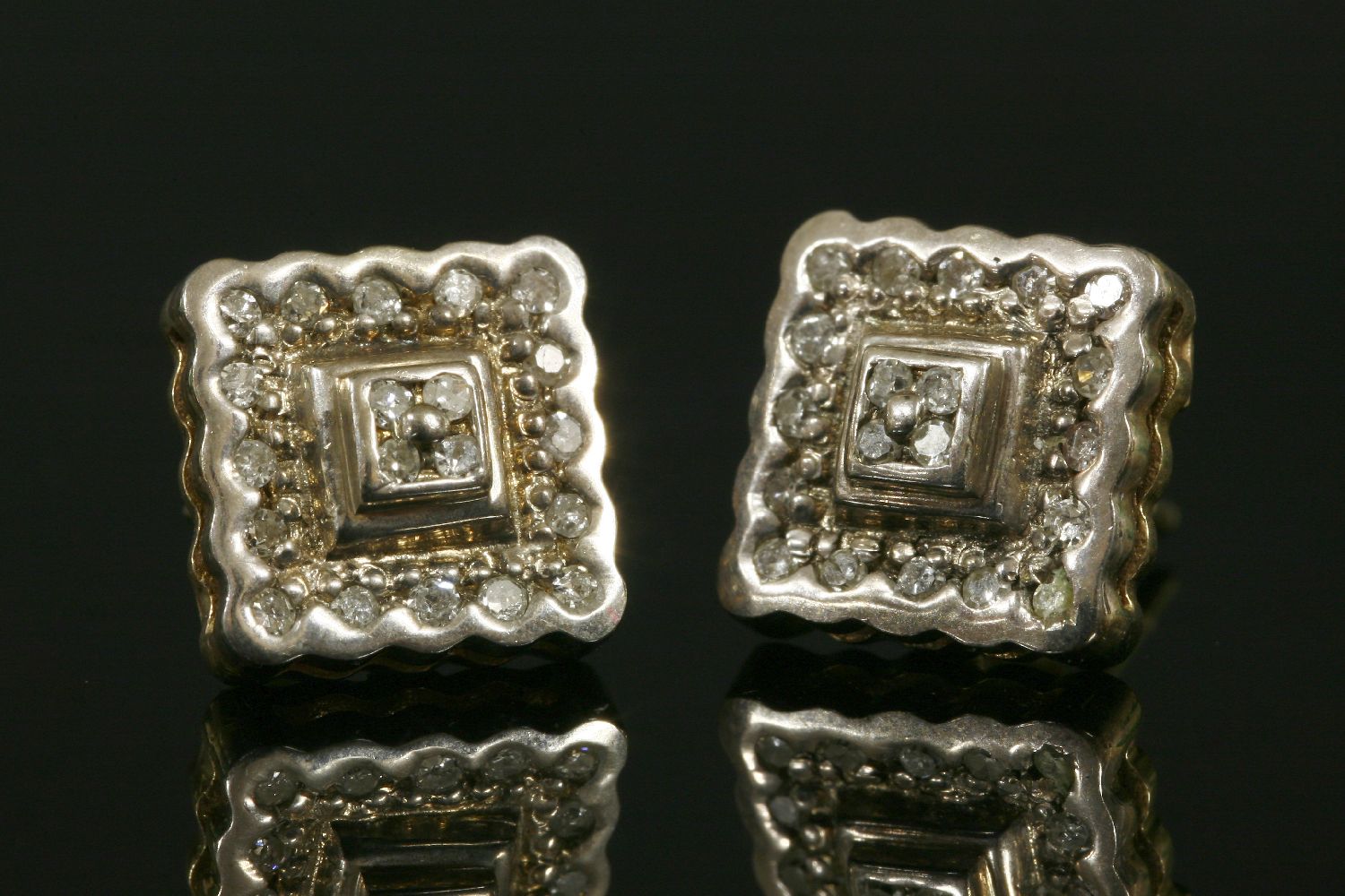 A pair of 9ct two-colour gold square two-tier diamond cluster earrings,with post and butterfly