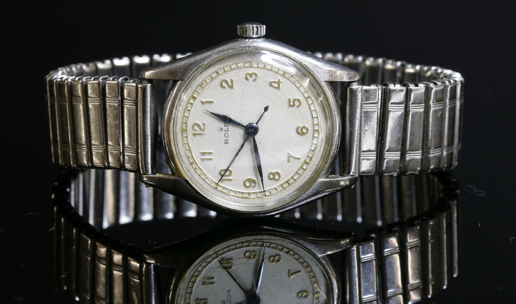 A gentlemen's stainless steel Rolex mechanical watch, c.1926, model no. 2285, a circular ivory-