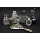 A silver topped cut glass scent bottle, a collection of scent bottles, and a silver dressing mirror