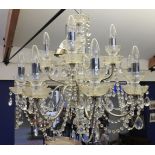 A pair of cut glass twelve light chandeliers, 64cm diameter and 85cm drop