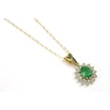 A 9ct gold oval cut emerald and illusion set diamond cluster pendant, on trace chain, 2.36g