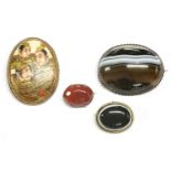 A Japanese gilt metal satsuma brooch, oval plaque painted with three figures (character mark),