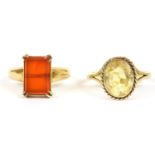 An 18ct gold single stone Cornelian ring, double claw set to a plain polished shank, 6.08g, a gold