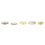 An 18ct gold single stone illusion set diamond ring, 3.13g, a 9ct gold seven stone diamond ring, 1.