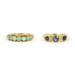 A 9ct gold graduated seven stone opal ring, 1.85g, and a gold three stone graduated sapphire and