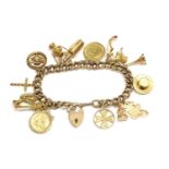 A 9ct gold hollow curb link charm bracelet, with padlock and fourteen assorted charms, including two