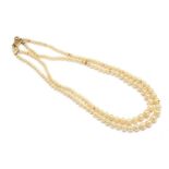 A two row graduated simulated pearl necklace, with gold clasp, marked 9ct