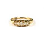 An Edwardian gold five stone boat shaped graduated ring, 3.89g