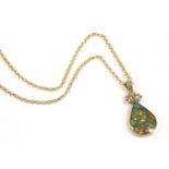 A 9ct gold opal triplet, mother of pearl reversible pendant, on a 9ct gold belcher link necklace,