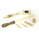 A collection of ivory items, 19th century, including: a page turner with a white metal handle, 33cm,