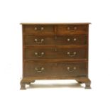 A George III chest, of two short and three long drawers, on ogee bracket feet, 87cm wide