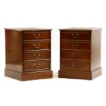 A pair of mahogany veneered two drawer filing cabinets, the tops with leather insets, 56cm wide,