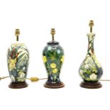 Three modern Moorcroft vase table lamps, vases 33.5cm and 29cm high