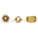 A 9ct gold shell cameo ring, 3.39g, a cultured pearl and garnet spray ring (9ct) 6.79g, a gold