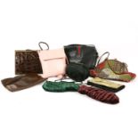 A collection of vintage handbags, including a 1950s brown leather crocodile effect example, and a