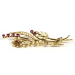 A gold seed pearl and ruby spray brooch, marked 14k (tested and valued as 9ct) 9,74g