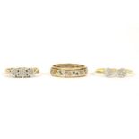 A 9ct gold three stone illusion set ring, size O, with ribbed triangular shoulders, 2.50g, an Art