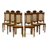A set of six Continental walnut dining chairs, each with carved cresting rail over a caned back