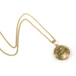 A 9ct gold circular locket, with engraved decoration, on a 9ct gold Prince of Wales chain, 10.31g