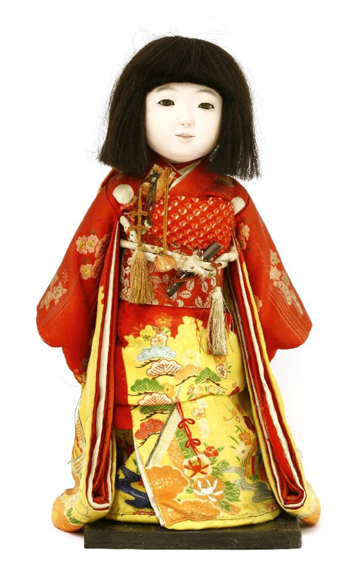 A Japanese 'lchimatsu Ningyo',20th century, a porcelain-headed doll with real hair and silk body,