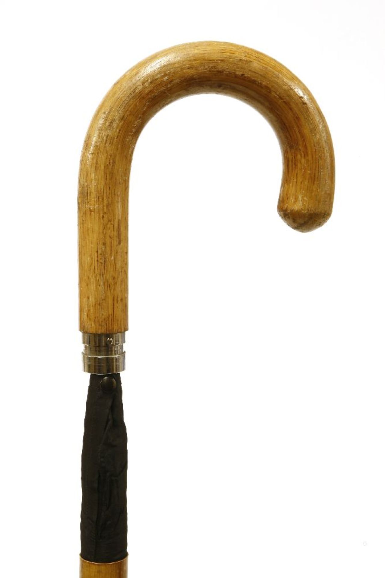 A stout traditional walking stick,c.1900, containing a rolled umbrella,89cm long
