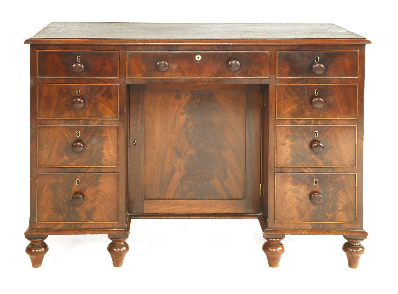 A William IV mahogany desk,with nine various drawers arranged around a central kneehole and