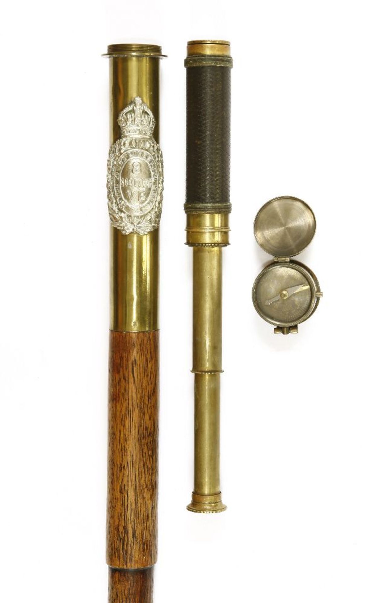 A Victorian stepped wooden walking stick,having a brass handle carrying the crest of the Kings
