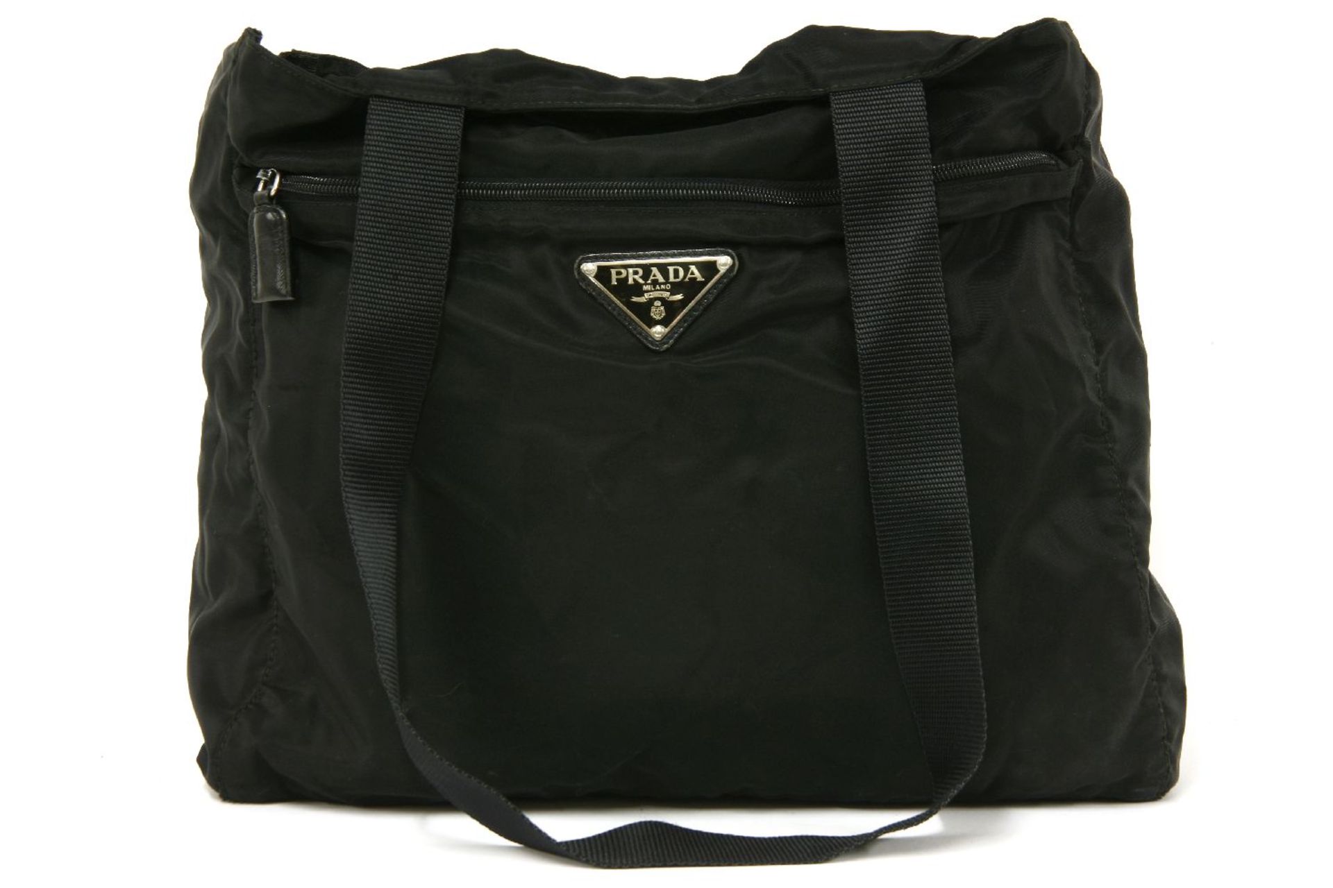 A Prada black canvas shopper handbag, exterior zip pocket with maker's signature enamel triangular