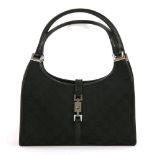 A Gucci 'Jackie' black canvas shoulder bag, with a black canvas exterior with smooth black leather