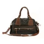 A Pauric Sweeney black distressed leather tote handbag,with dark tan leather and patent leather