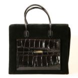 An Escada black suede handbag,of rectangular form, with a crocodile embossed leather pocket with