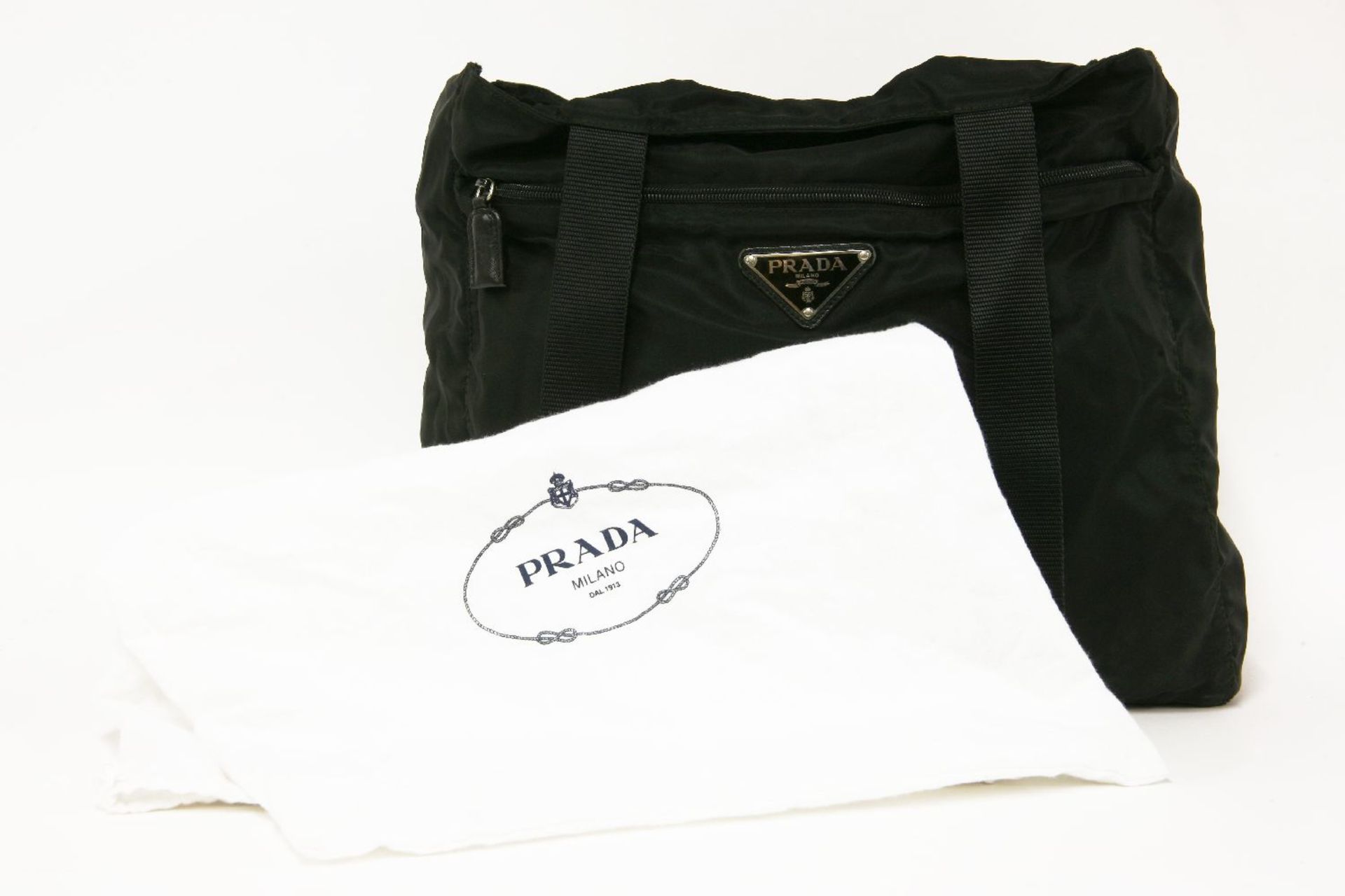 A Prada black canvas shopper handbag, exterior zip pocket with maker's signature enamel triangular - Image 2 of 2