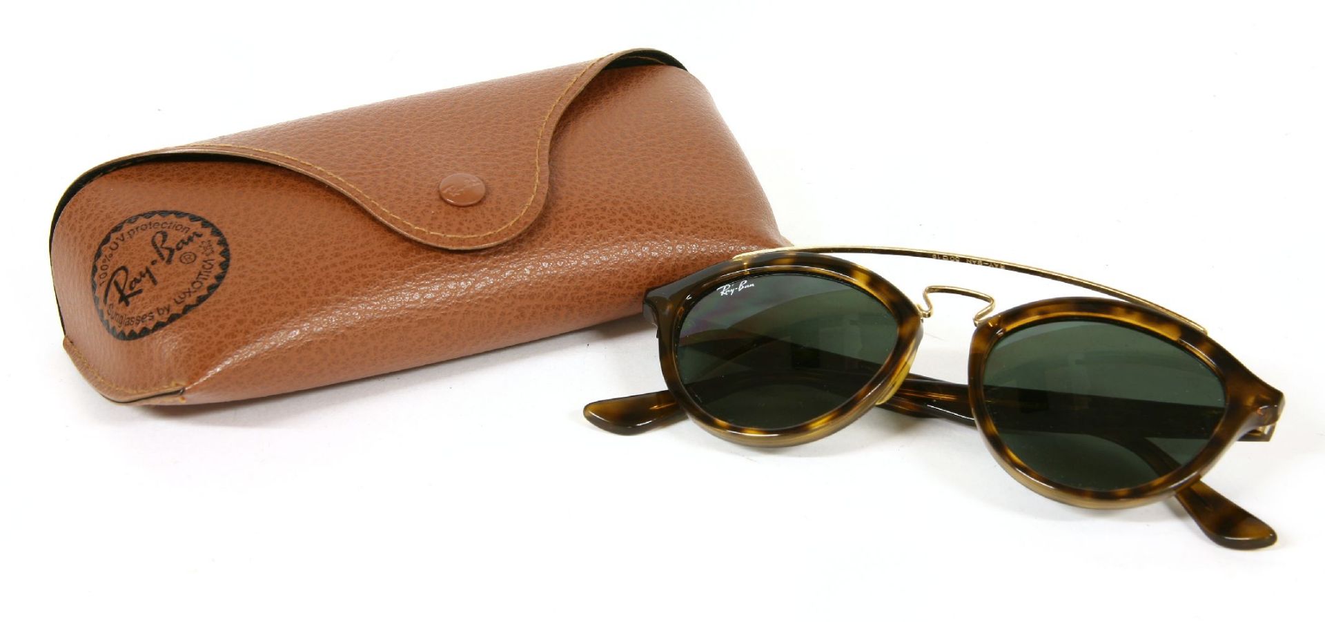 A pair or Ray-Ban 'Gatsby' sunglasses,tortoiseshell frames, with gold-tone crossbar and black tinted