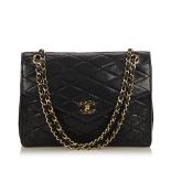 A Chanel matelassé leather chain flap bag,featuring a leather body, exterior back open pocket,