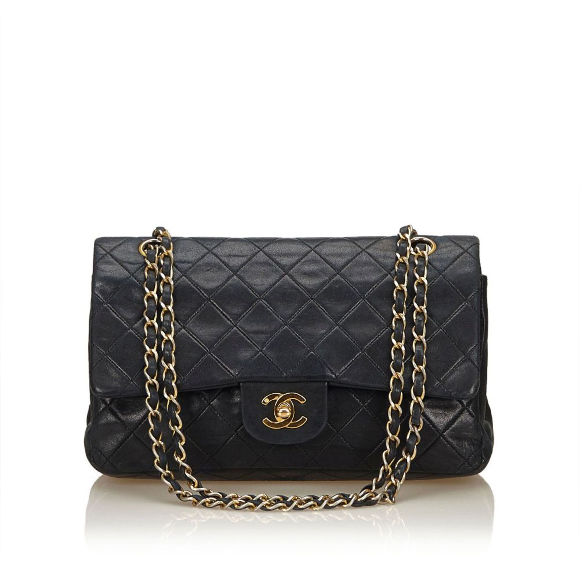 A Chanel classic medium double flap bag,featuring a quilted lambskin leather body, chain shoulder