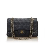 A Chanel classic medium double flap bag,featuring a quilted lambskin leather body, chain shoulder