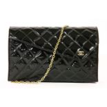 A vintage Chanel black patent quilted clutch handbag,with silver-tone double 'C' monogram to a