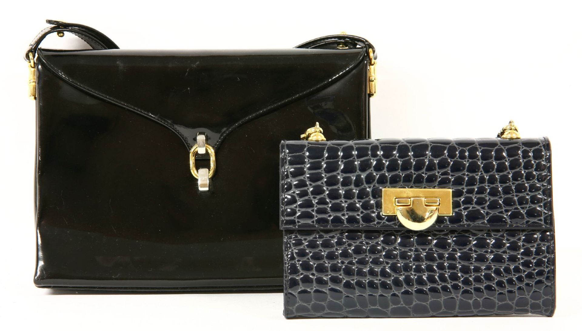 An Aquascutum black patent handbag, with gold and silver-tone clasp and hardware, a suede interior