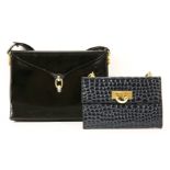 An Aquascutum black patent handbag, with gold and silver-tone clasp and hardware, a suede interior