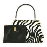 An Escada zebra patterned tote shopper handbag,with woven black and clear plastic handles, and a