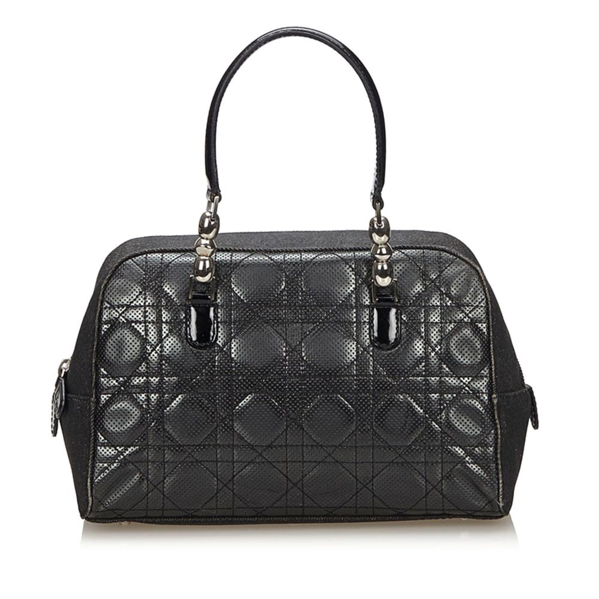 A Dior handbag,featuring a cannage perforated leather body, silver-tone hardware, flat patent