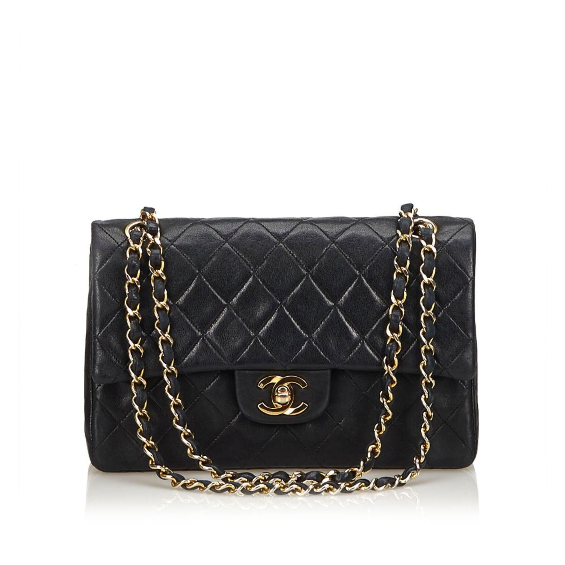 A Chanel classic small leather double flap shoulder bag,featuring a quilted leather body, gold-