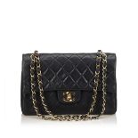 A Chanel classic small leather double flap shoulder bag,featuring a quilted leather body, gold-