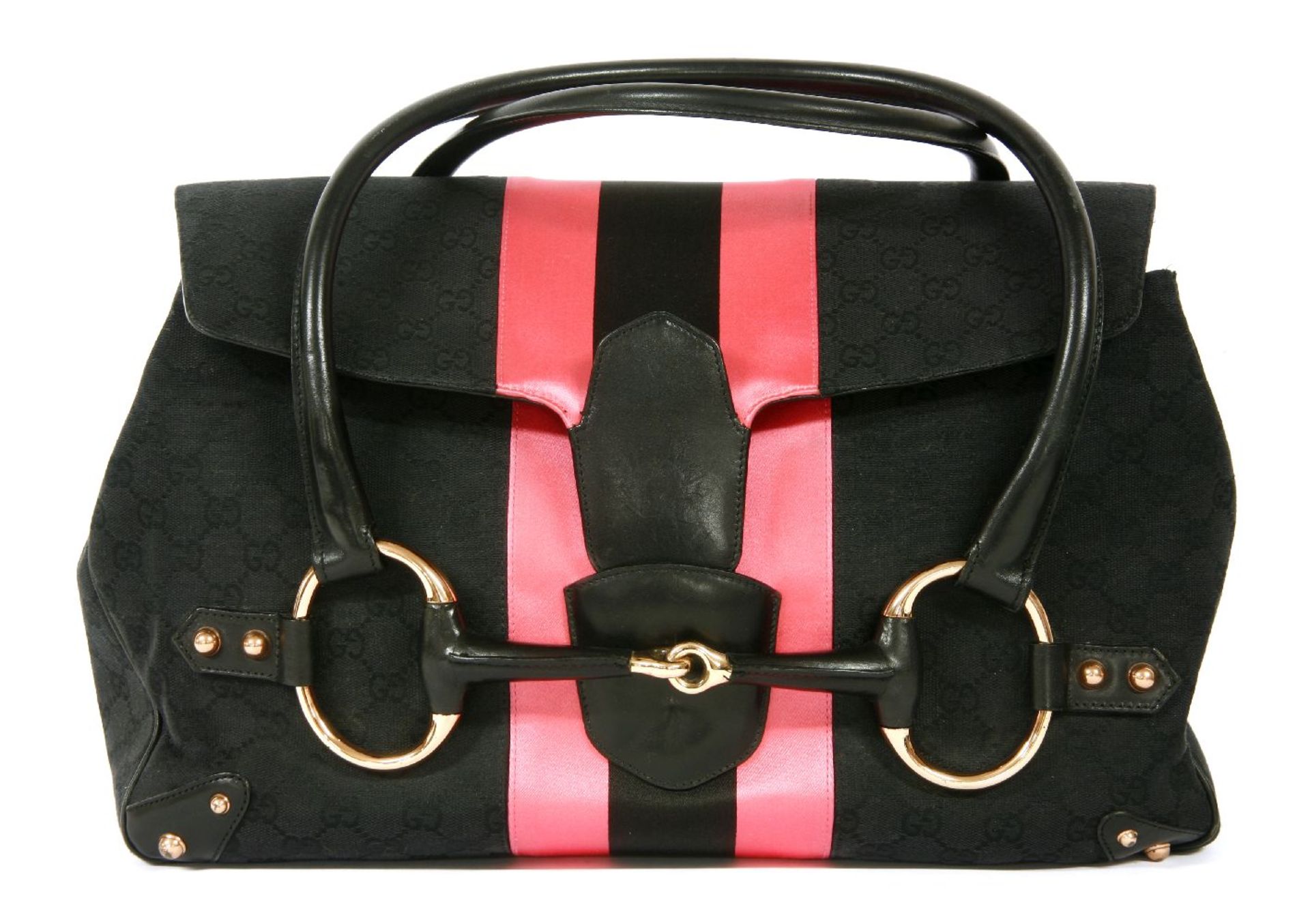 A Gucci by Tom Ford horse bit tote handbag, designed in the maker's black monogram canvas