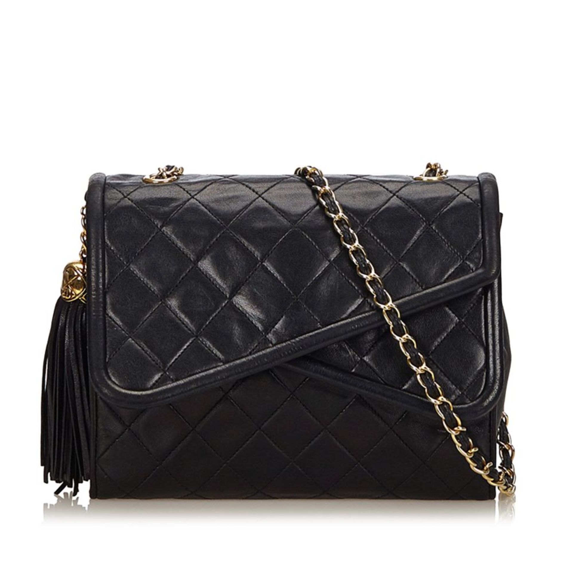 A Chanel matelassé tassel double flap shoulder bag,featuring a lambskin leather body, gold-tone