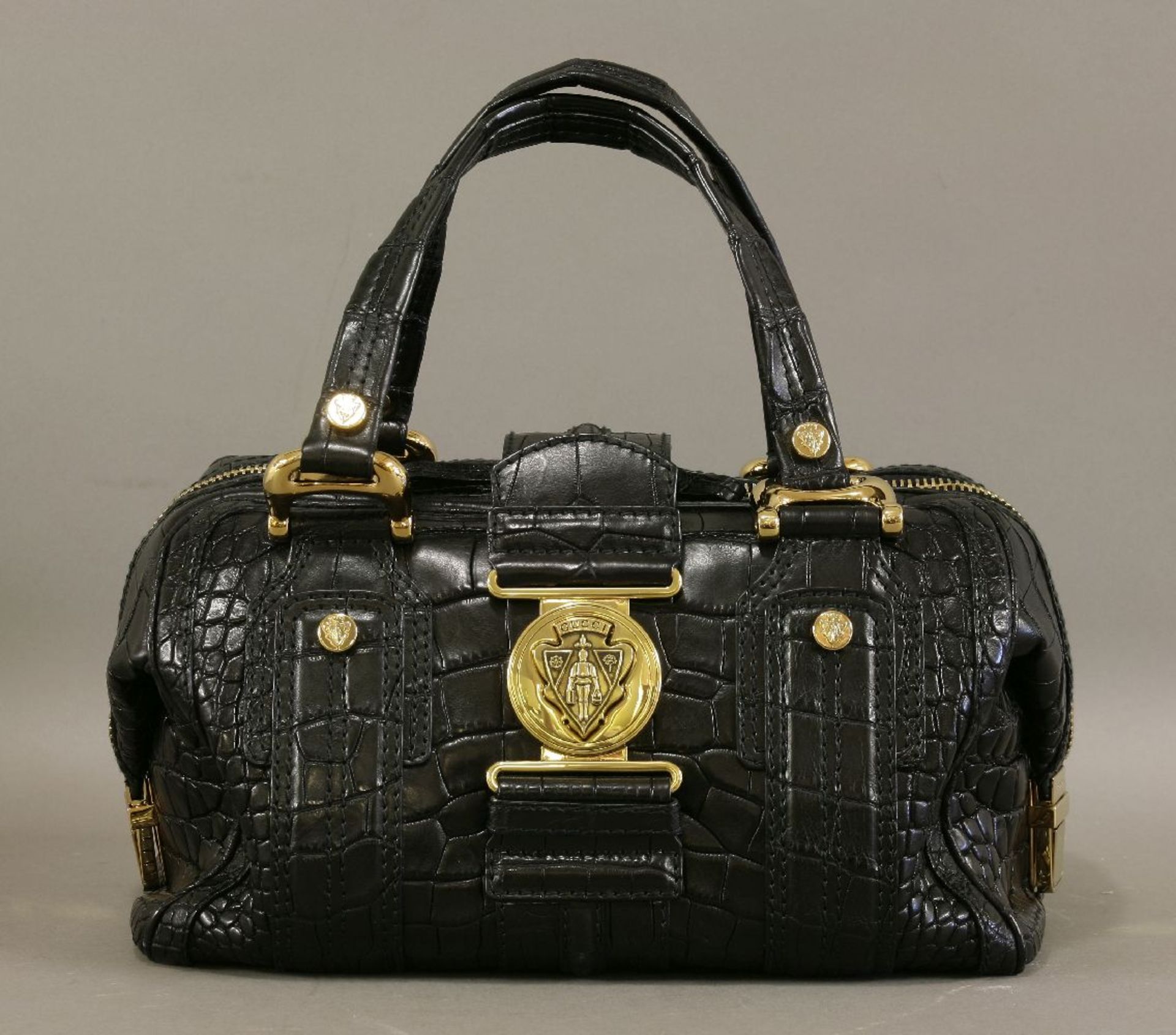 A Gucci crocodile 'Aviatrix Boston' handbag,black crocodile-skin with gold-toned hardware, dual