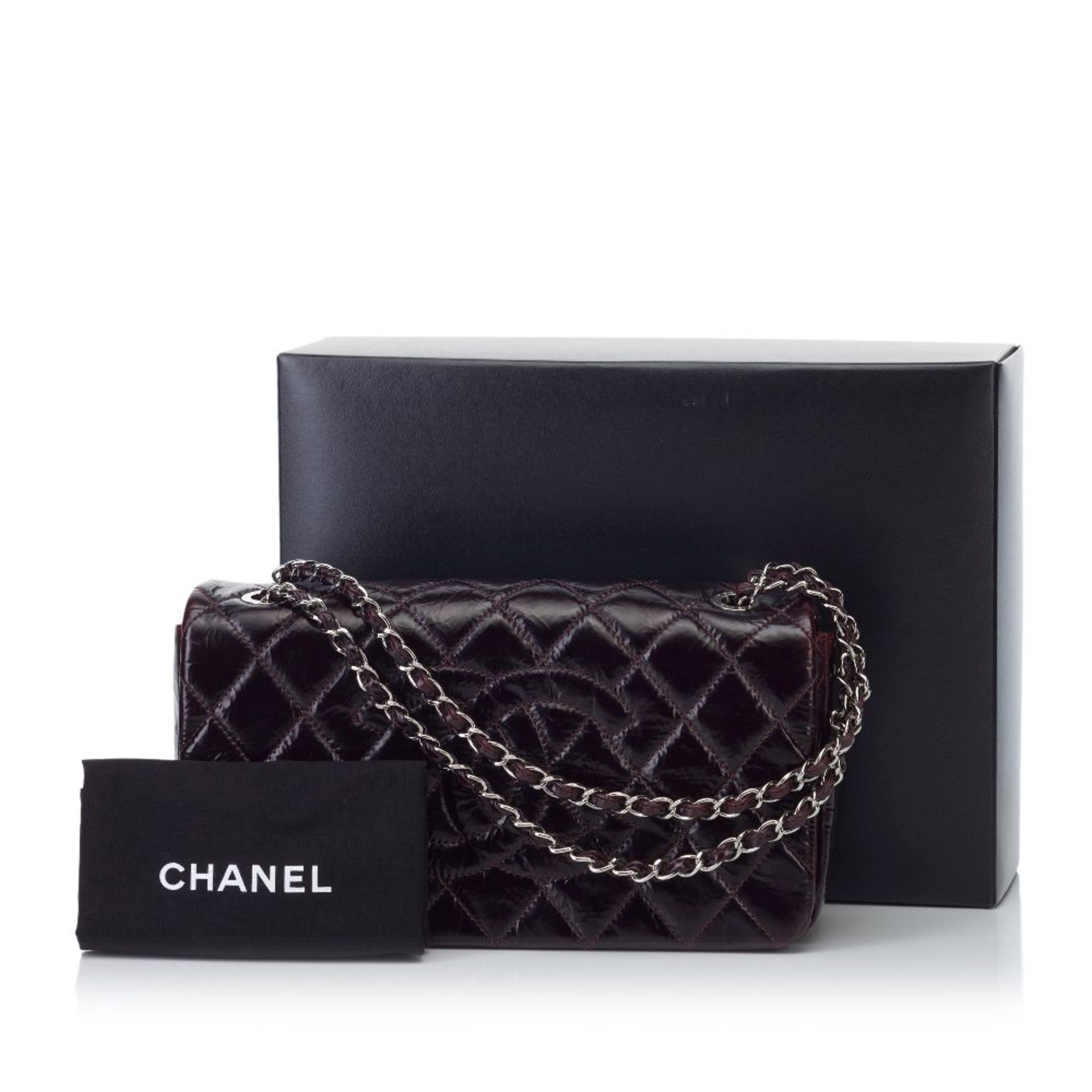 A Chanel matelassé patent leather shoulder bag,a patent leather body, exterior back slip pocket, - Image 2 of 2