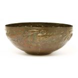 A Newlyn Arts and Crafts copper bowl,the deep bowl decorated with a frieze of gurnard amongst