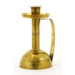 A brass chamberstick,by Carl Deffner, with a loaded plinth,15.5cm high