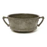 A Liberty & Co. pewter fruit bowl,designed by David Veazey, the cast bowl with stylised panels and